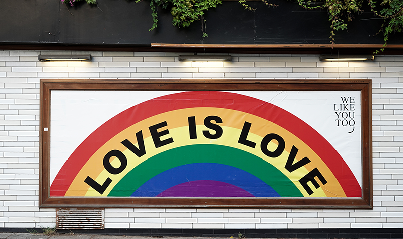 Love is Love written across brick wall